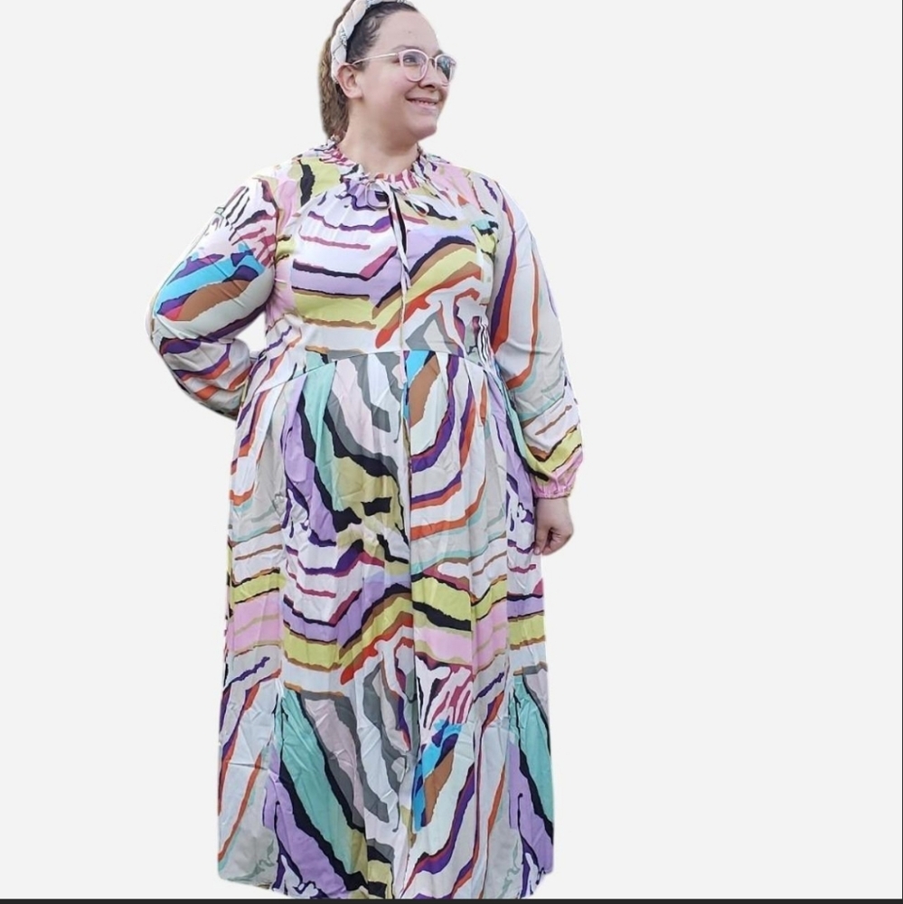 A multi-colored oversized dress, with drawstring neck.